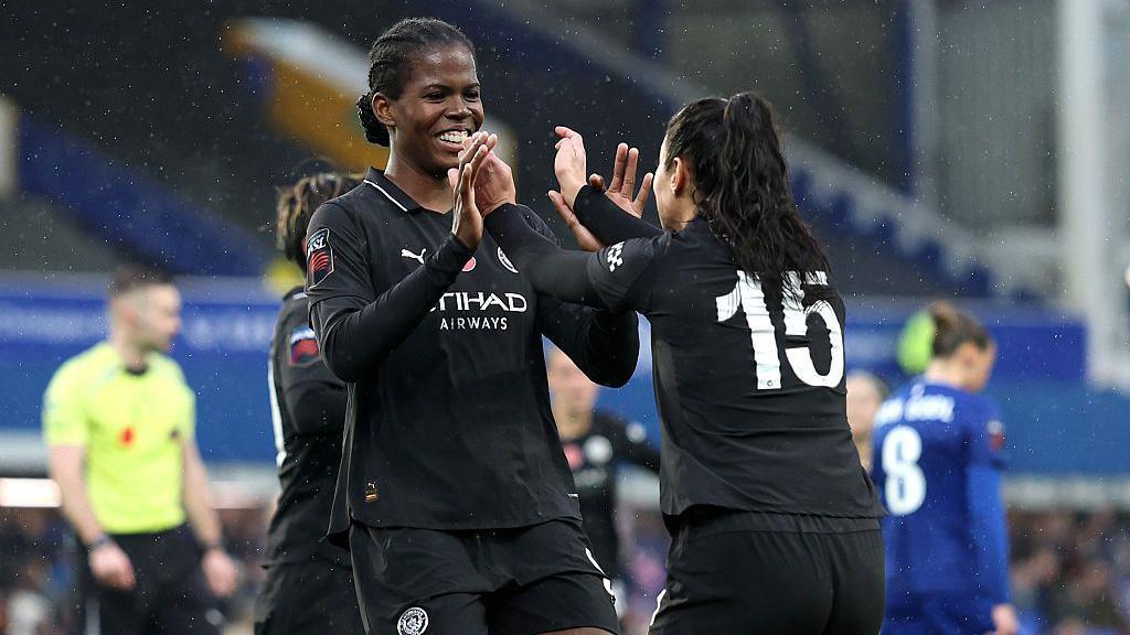 Khadija Shaw of Manchester City celebrates scoring her team's second goal with teammate Leila Ouahabi 