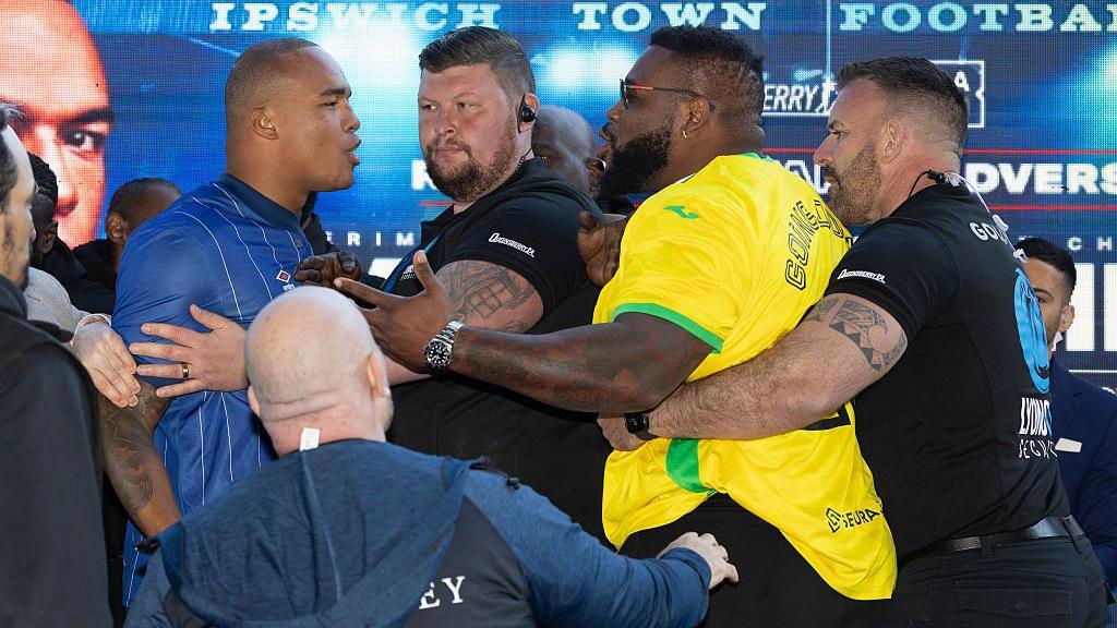 Security stands between Fabio Wardley and Jarrell Miller