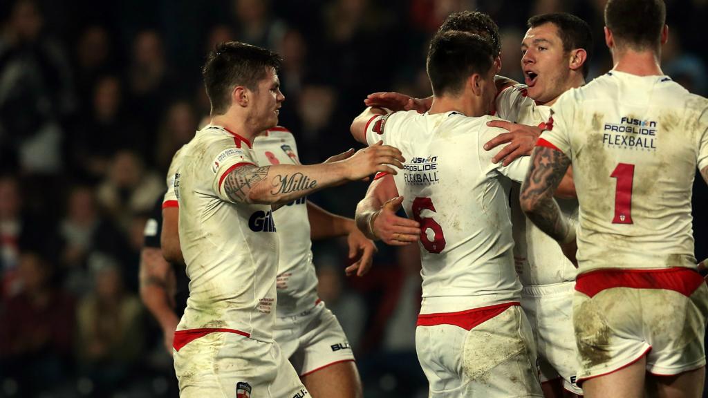 England's Brett Ferres celebrates scoring a try