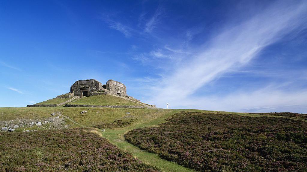 Offa's Dyke Path and the Jubilee Monument on the summit of Moel Famau in the Clwydian Range.