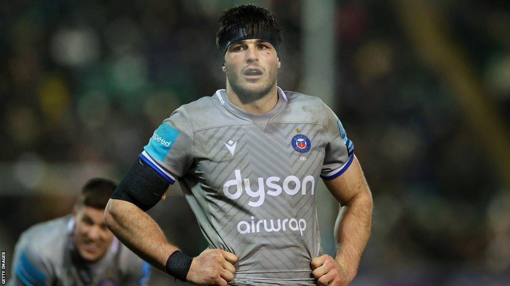 Josh Bayliss stands on the pitch during Bath's Premiership match with Northampton last season