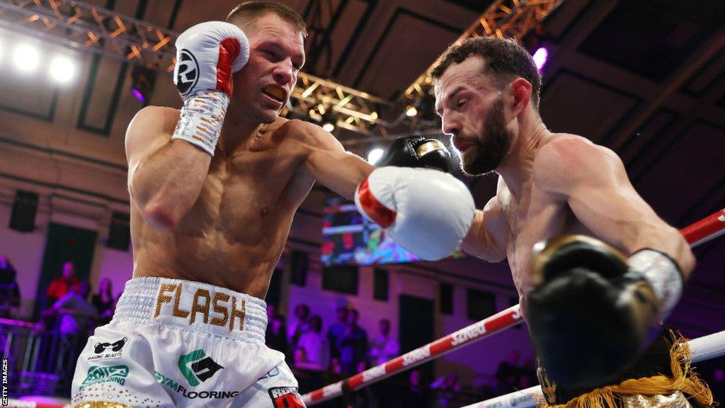 Ashley Lane (left) punches Chris Bourke