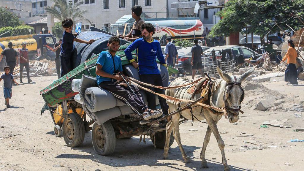 A donkey cart of displaced Palestinians on their way to find somewhere to stay after Israeli authorities order to evacuate area once was claimed to be safe humanitarian zone due to further military operation in the eastern part of Khan Younis, Gaza on July 23, 2024