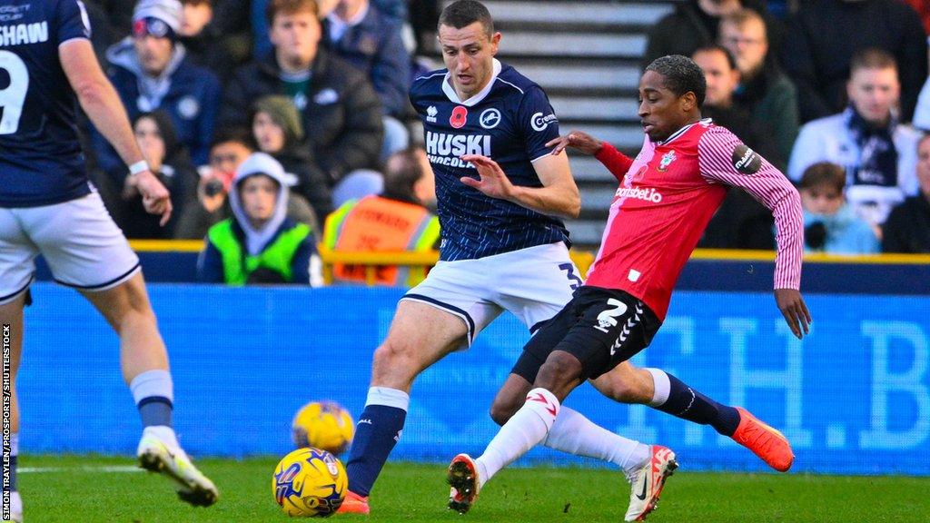 Millwall defender Murray Wallace (3) and Southampton defender Kyle Walker-Peters (2) battles for possession during the EFL Sky Bet Championship match between Millwall and Southampton at The Den, London