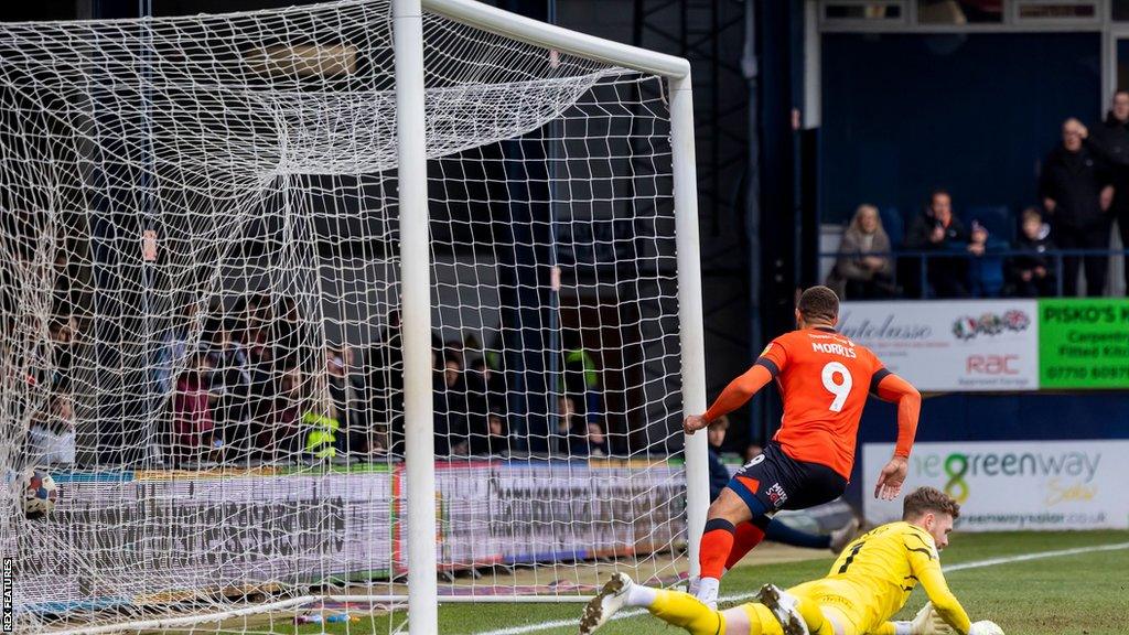 Carlton Morris turns to celebrate after scoring against Swansea for the second time this season