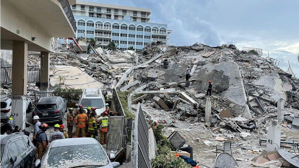 Rescuers search the wreckage of the collapsed building in Surfside, Florida