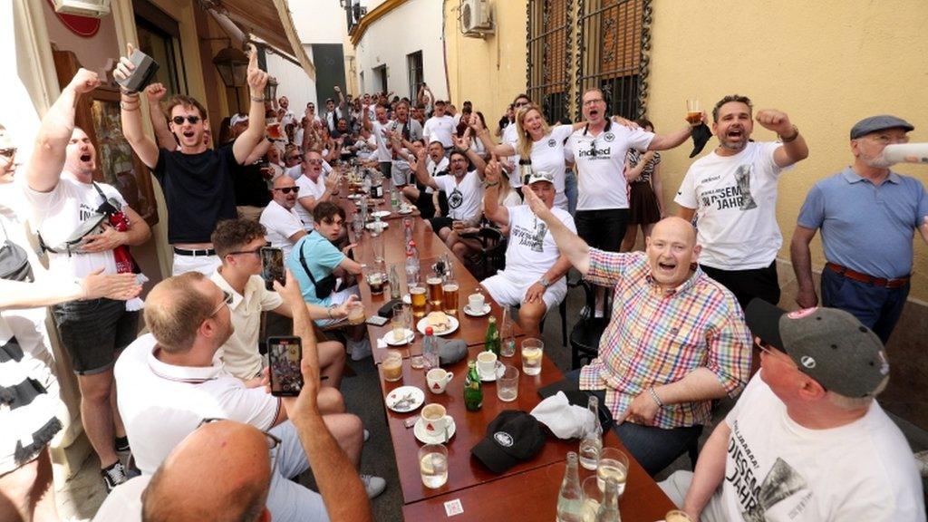 Eintracht Frankfurt fans at a street cafe