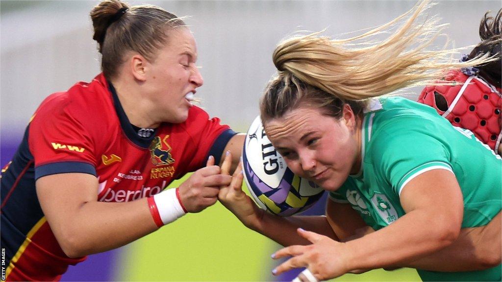 Ireland and Spain players fight over the ball in the WXV3 final in Dubai