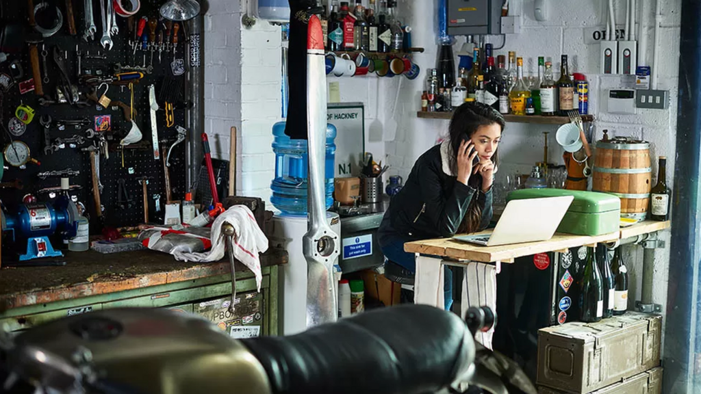 Woman at laptop in workshop