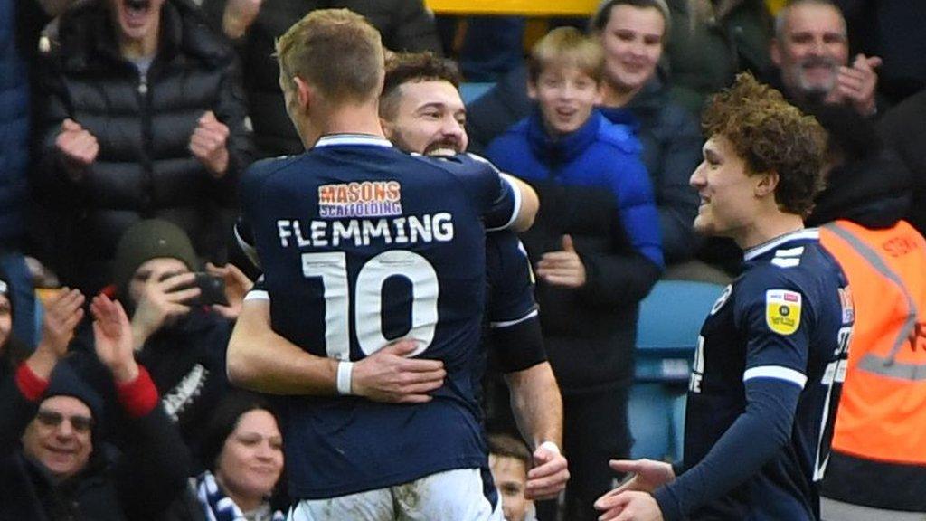 Millwall forward Tom Bradshaw celebrates opening the scoring