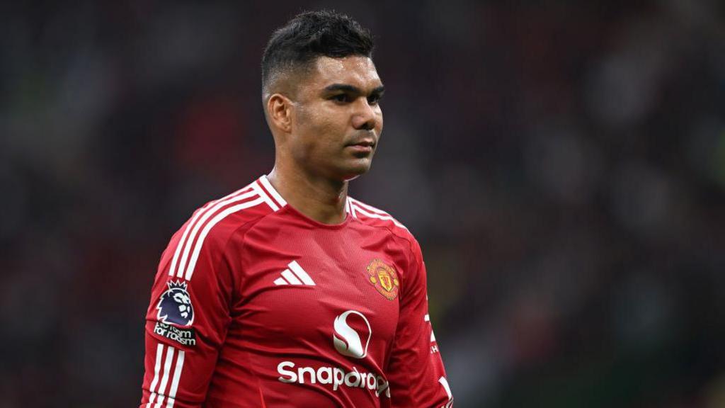 Casemiro looks on during Manchester United's loss to Liverpool