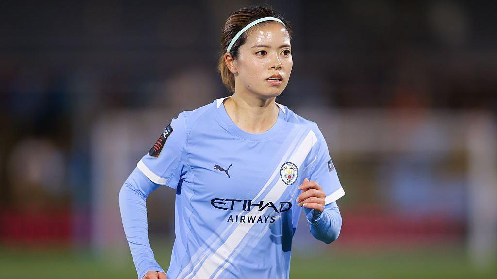 Yui Hasegawa in Manchester City's light blue home shirt