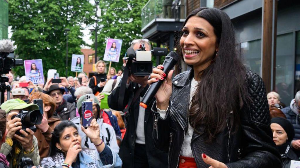 Faiza Shaheen speaks to supporters during a rally held on her behalf after being excluded from the Labour Party's list of candidates