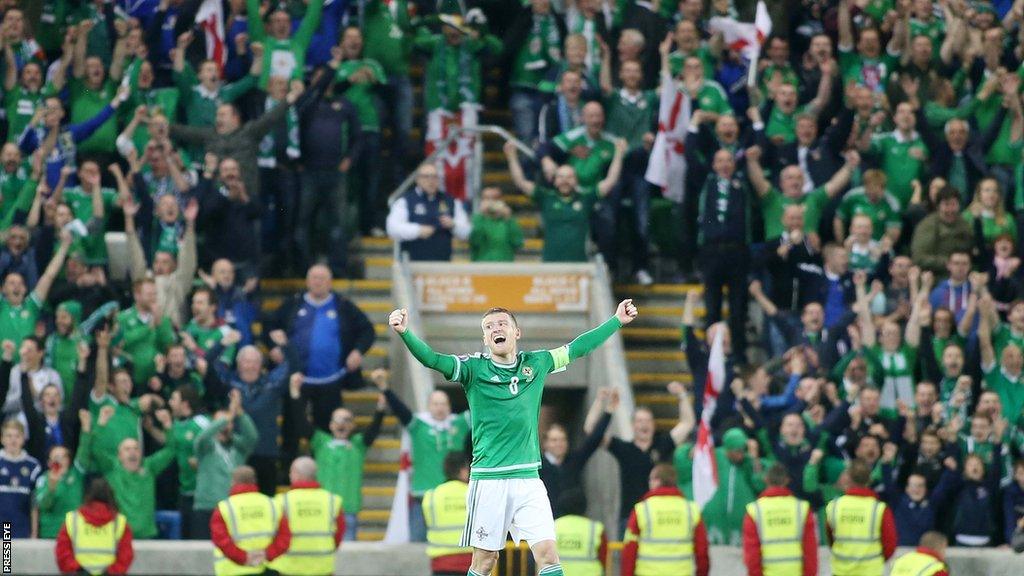 Steven Davis celebrates qualifying for the Euro 2016 finals