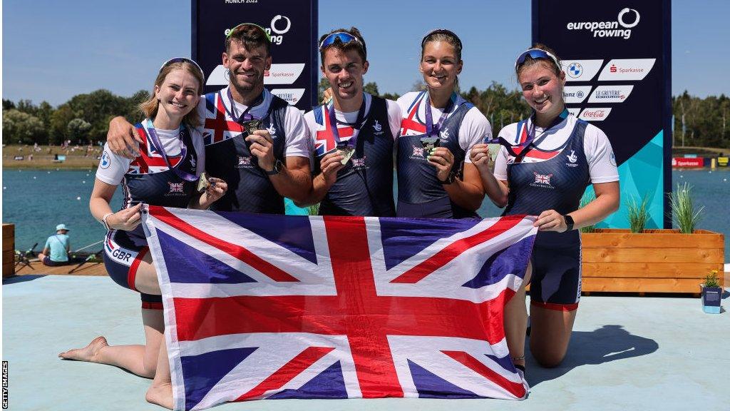 Erin Kennedy with her mixed coxed four crew after winning gold at the European Championships in 2022