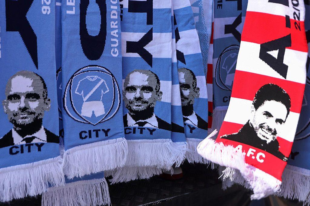 Scarves for Manchester City and Arsenal showing images of Pep Guardiola and Mikel Arteta