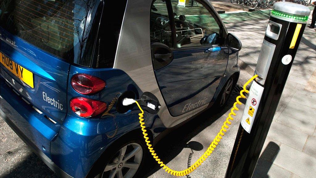 Electric car at charging point