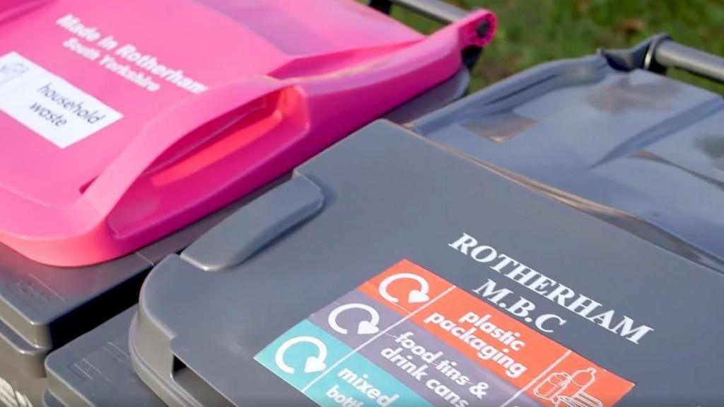 A close-up of two bins with Rotherham MBC printed on the lid