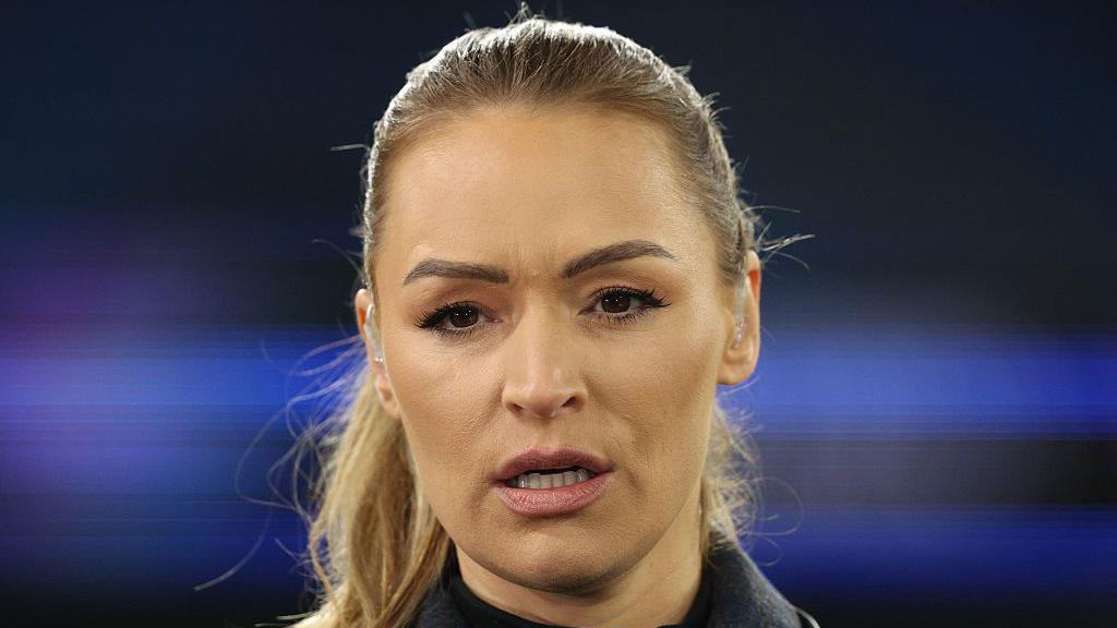 Laura Woods looks on from the touchline while hosting TNT Sprots' Uefa Champions League coverage