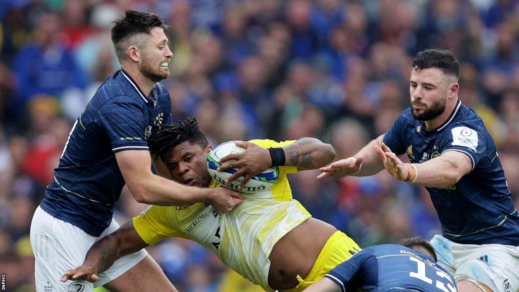 Ross Byrne, Robbie Henshaw and Garry Ringrose tackle Jonathan Danty during the 2022-23 Champions Cup final