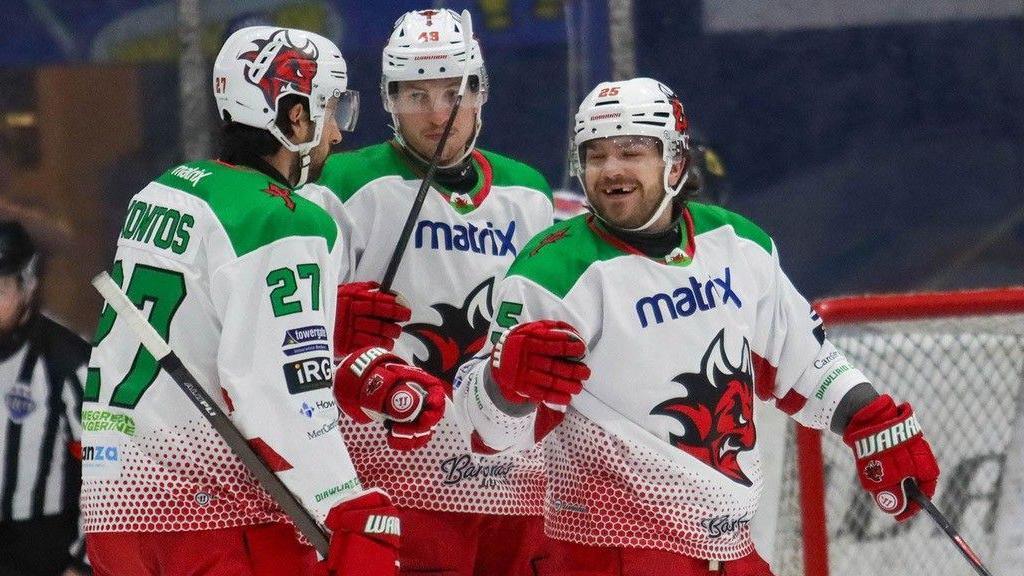 Riley Brandt celebrates his goal with Devils team mates