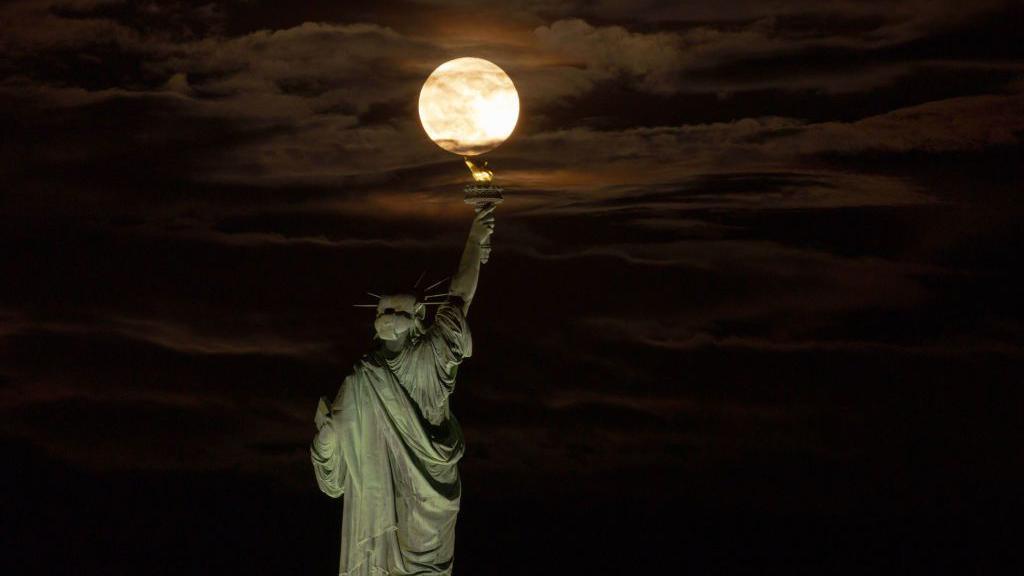 Supermoon above the Statue of Liberty in New York