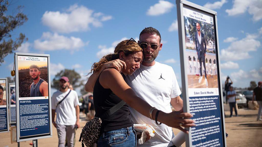 isitors at the Nova music festival memorial site on the second anniversary of the Hamas attack near Kibbutz Reim, southern Israel, on Tuesday. Oct. 7, 2025