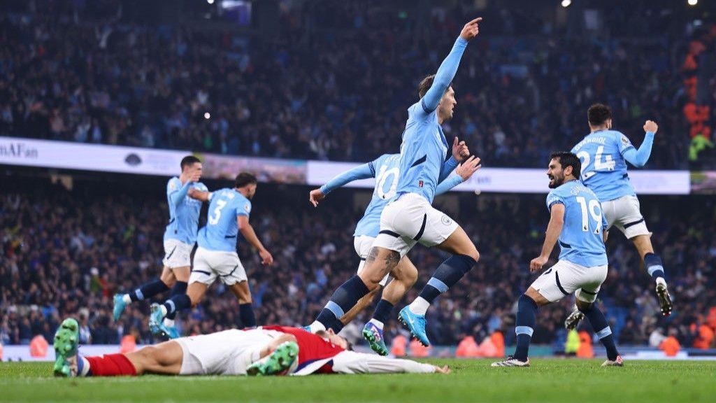 John Stones scores in a 2-2 draw with Arsenal