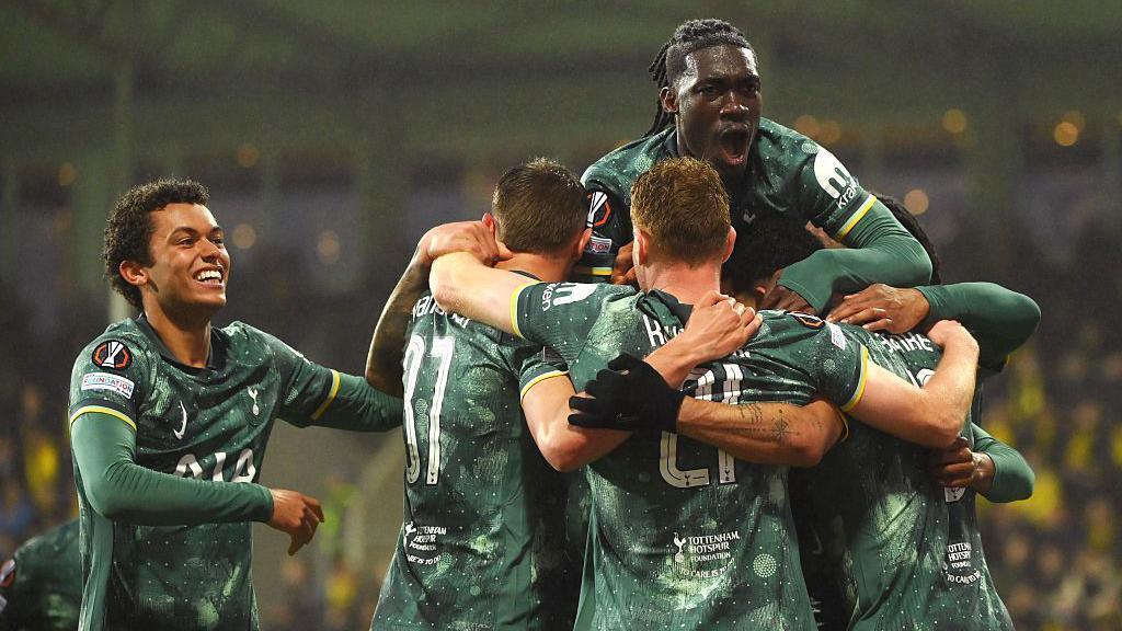 Spurs players celebrating their first goal.