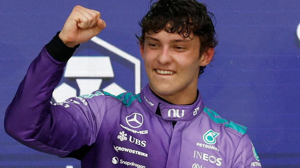 Kimi Antonelli clenches his fist in celebration on the podium after winning the Miami Grand Prix