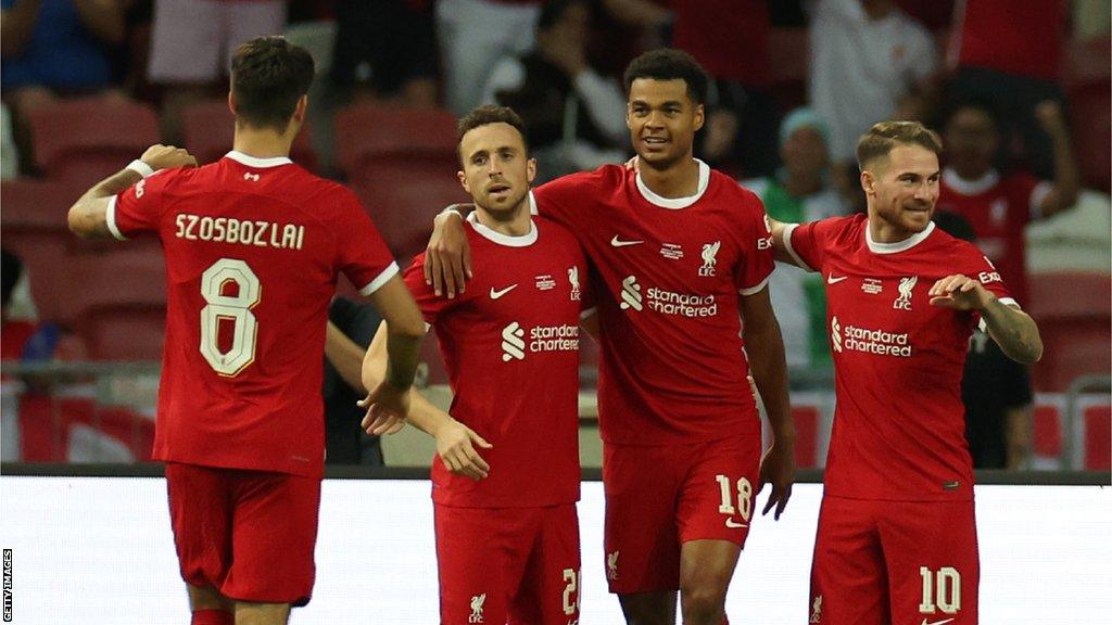 Cody Gakpo (second from right) celebrates opening the scoring for Liverpool