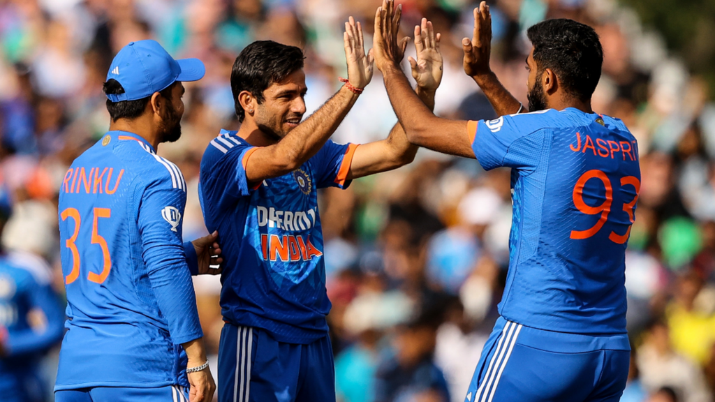 Ravi Bishnoi celebrates a wicket with Mukesh Kumar and Jasprit Bumrah