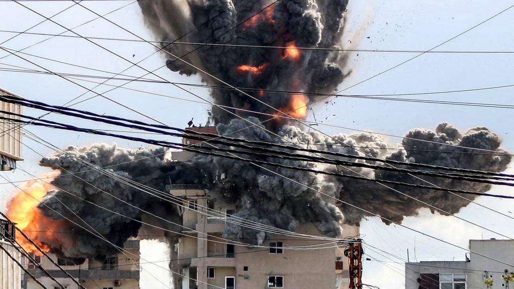 A fireball rises from a building hit by an Israeli airstrike in the area of Abbasiyeh, on the outskirts of the southern Lebanese city of Tyre, on April 8, 2026. Lebanon's army warned people against returning to the country's south on April 8, where the Israeli military is still launching attacks, as Israel said the ceasefire with Iran did not include its conflict with Hezbollah.