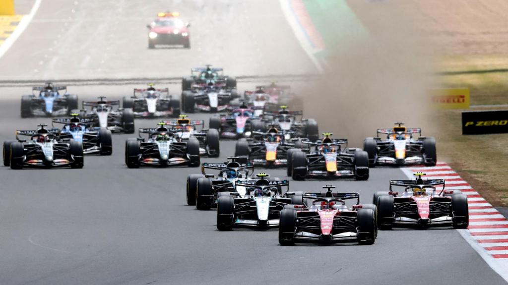 Ferrari's Charles Leclerc leads the field into the first corner of the 2026 British Grand Prix