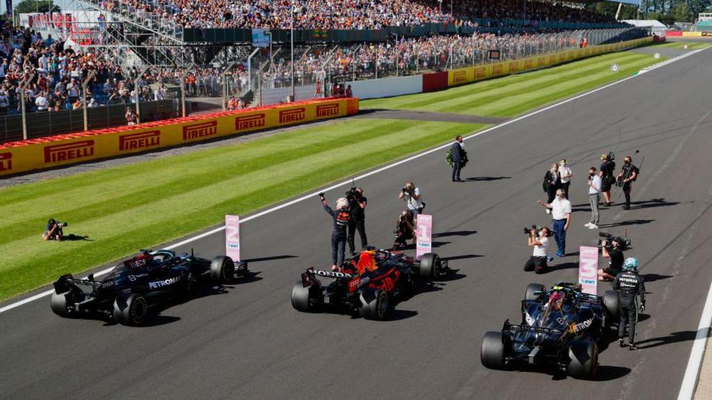 Max Verstappen waves to the Silverstone crowd after winning the sprint race in 2021 