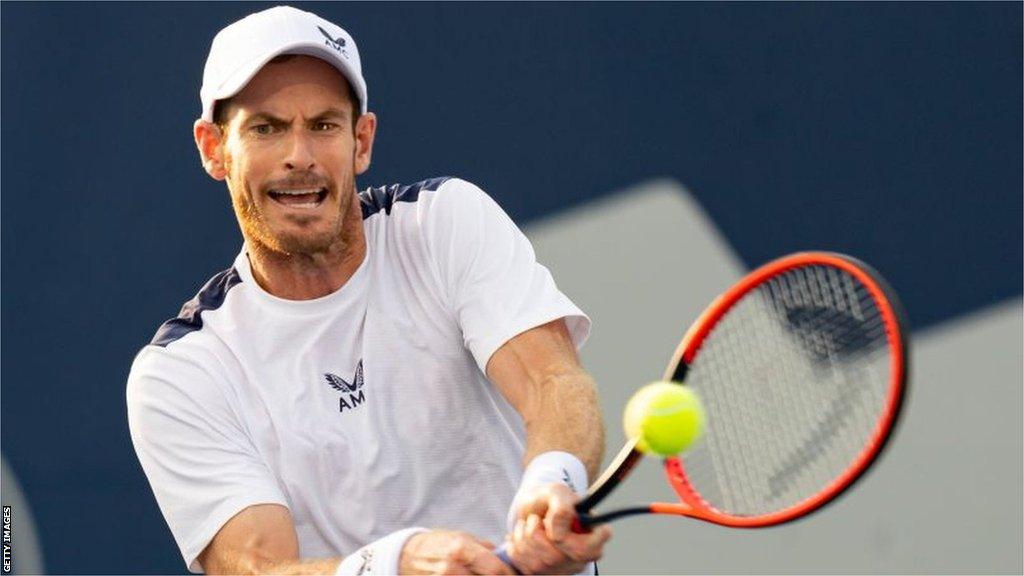 Andy Murray returns the ball during his second-round match in Toronto