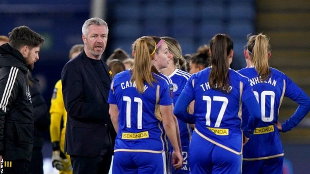 Leicester City manager Willie Kirk speaks to his players