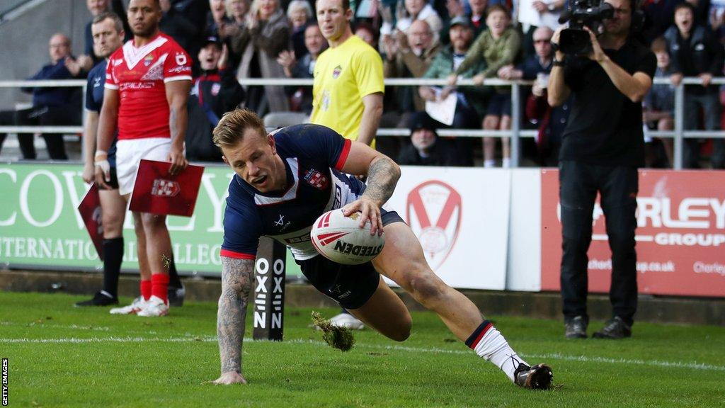 Tom Johnstone scores a try for England versus Tonga