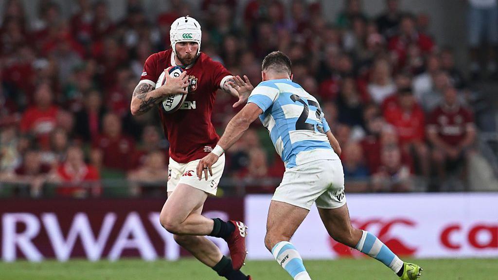 Mack Hansen of British & Irish Lions is challenged by Santiago Cordero of Argentina during the 1888 Cup international match between British & Irish Lions and Argentina at Aviva Stadium on June 20, 2025 in Dublin, Ireland
