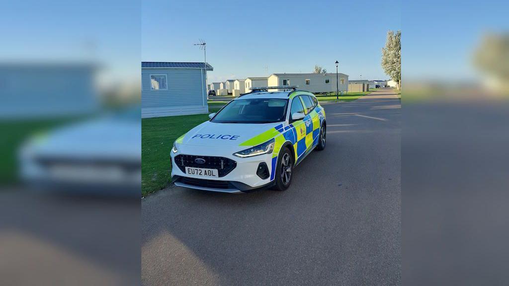 Essex Police car parked at a caravan park