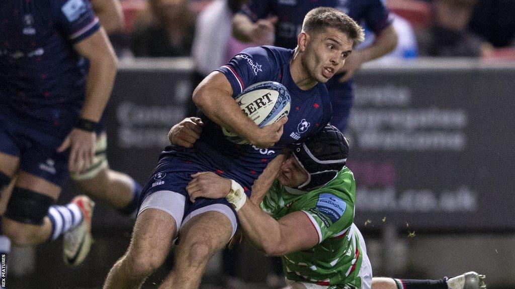 Harry Randall is tackled while running with the ball during Bristol's win against Leicester this season