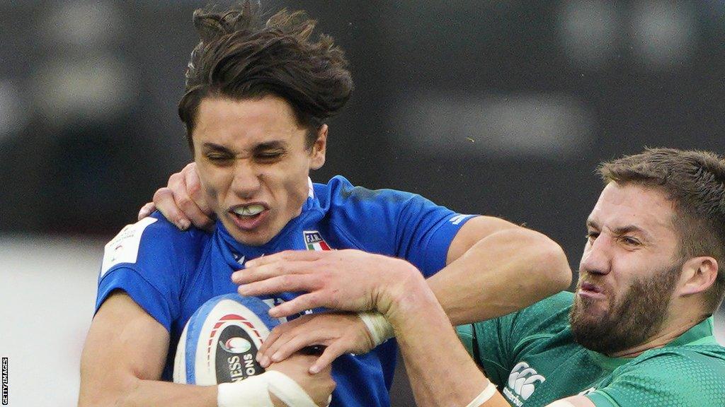 Ange Capuozzo of Italy is halted by Stuart Mccloskey of Ireland