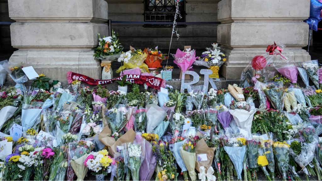 Flowers, balloons and tributes lay on the steps of Nottingham Council House after the attack