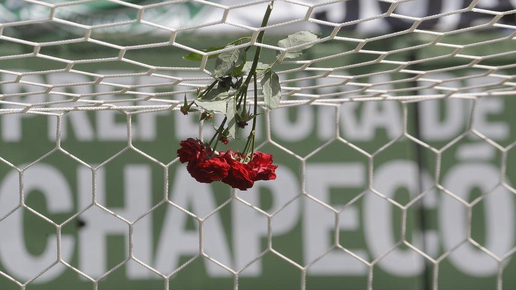 Flowers hang from a goal net during a memorial at Arena Conda stadium in Chapeco, Brazil, in honour of the Chapecoense football players who died in a plane crash,.