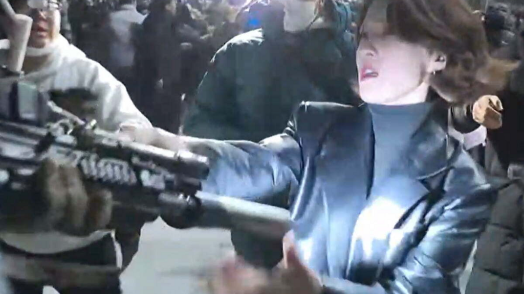 Woman grabbing gun in Seoul