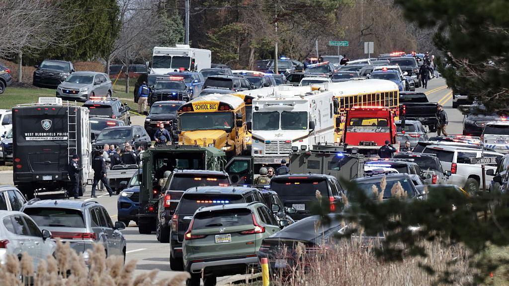 Law enforcement responds at the scene of a shooting on Walnut Lake Rd, outside of Temple Israel synagogue, in West Bloomfield,