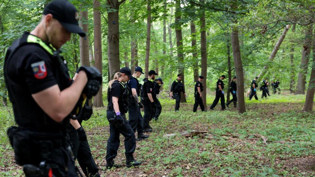 Police search the area after a deadly incident in which a vehicle crashed into a crowd near Berlin's annual Christopher Street Day Pride parade on Saturday evening