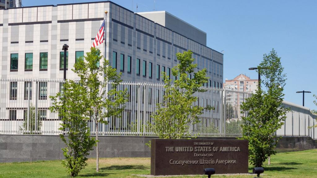 Building of the Embassy of the United States of America with granite plate with the inscription "The Embassy of the USA " in English and Ukrainian languages in Kyiv, Ukraine.