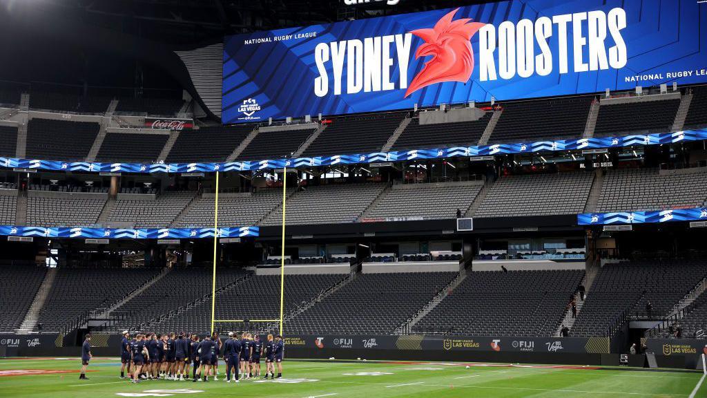 The Sydney Roosters huddle up as a team during their NRL Captain's Run at Allegiant Stadium.