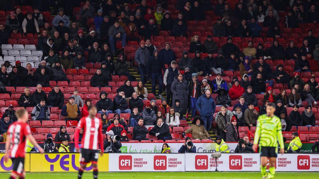 Fans of Sheffield United leave the match early